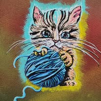 Chaton et pelote de laine bleue